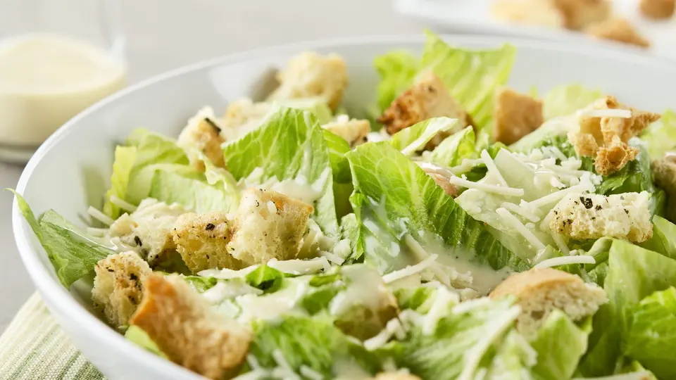 Classic Caesar salad with grilled chicken and Parmesan