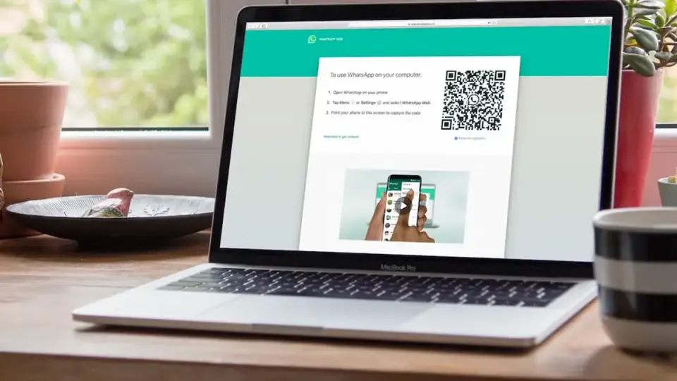 WhatsApp Web on a laptop screen